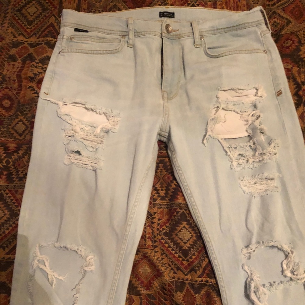 Men’s light blue distressed (ripped) jeans size 34